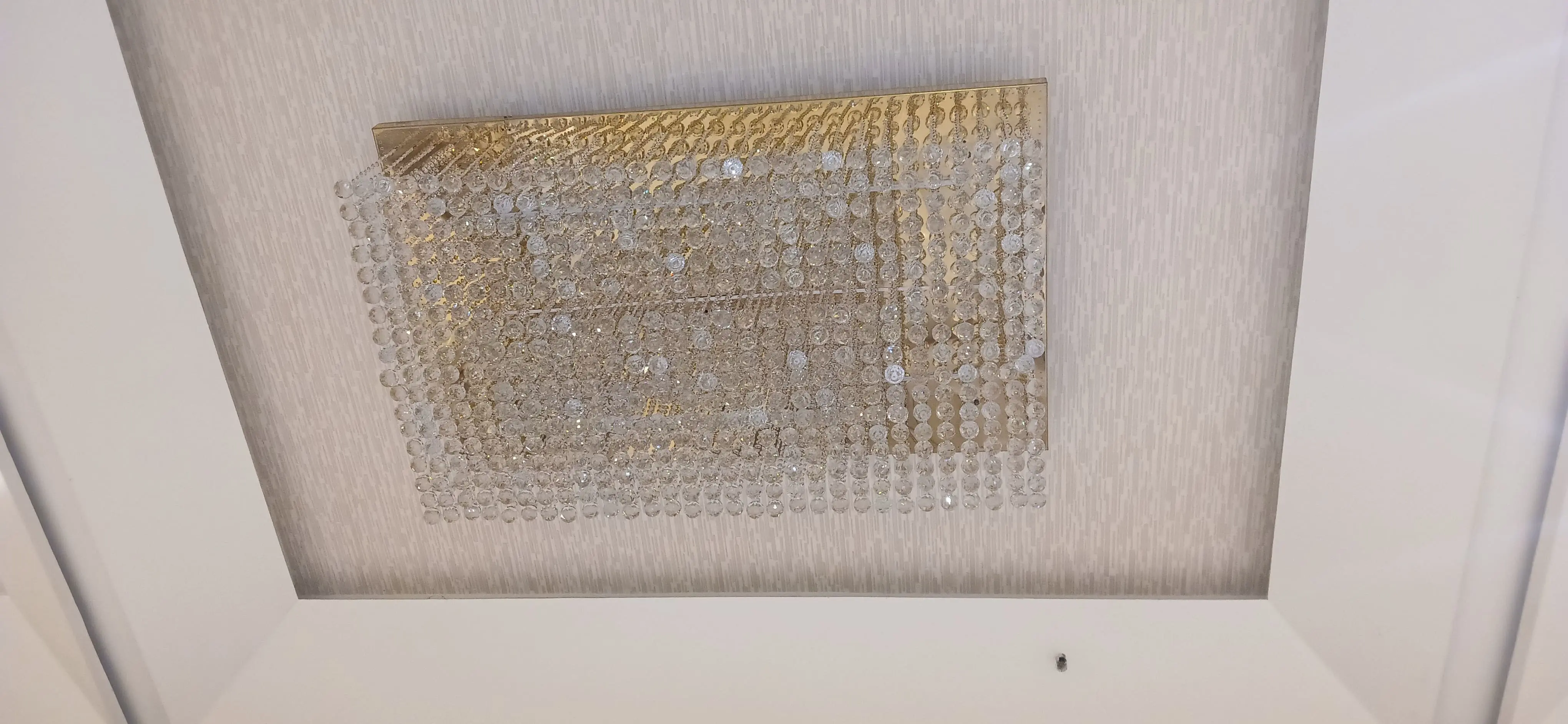 Banquet hall high ceiling chandelier cleaning service with safety equipment