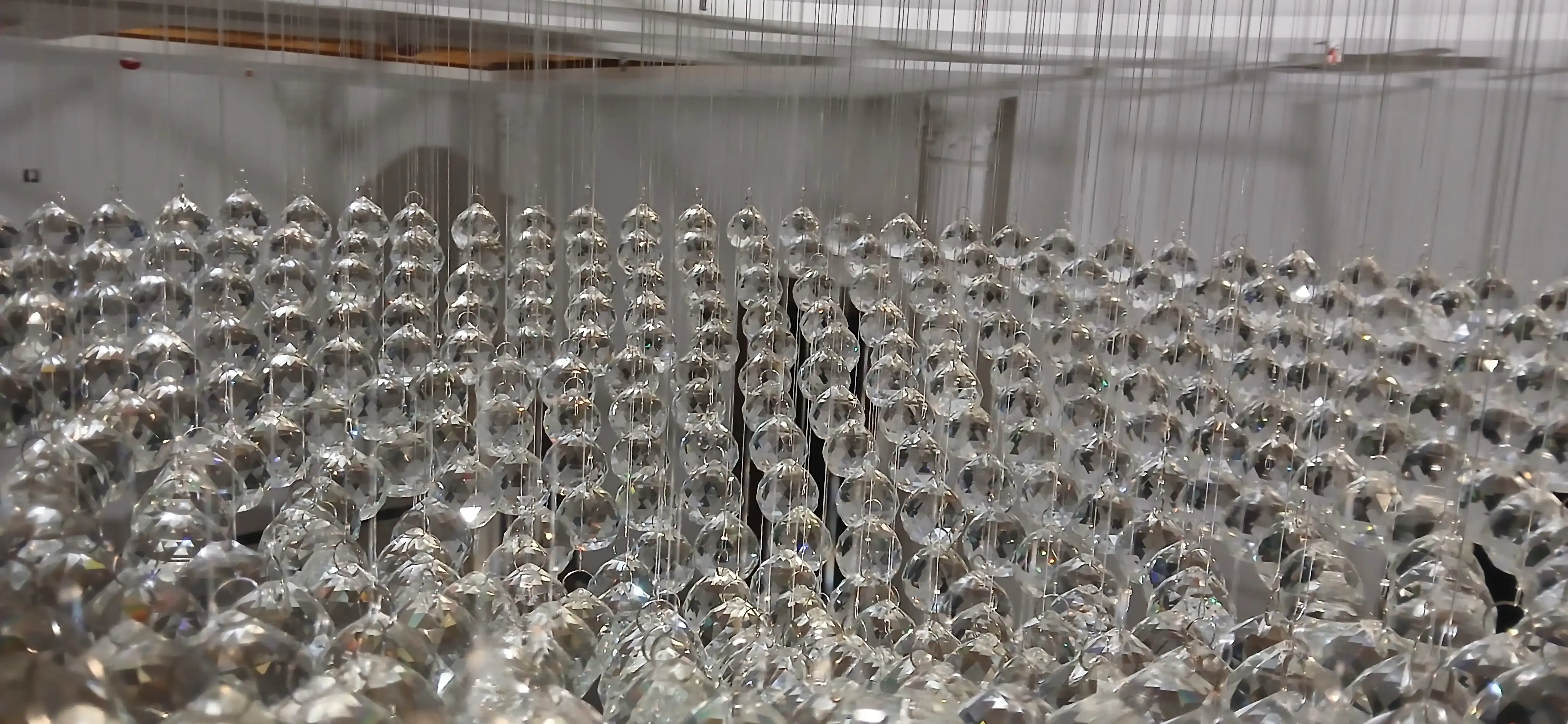Close-up view of faceted crystal elements used in a luxury chandelier