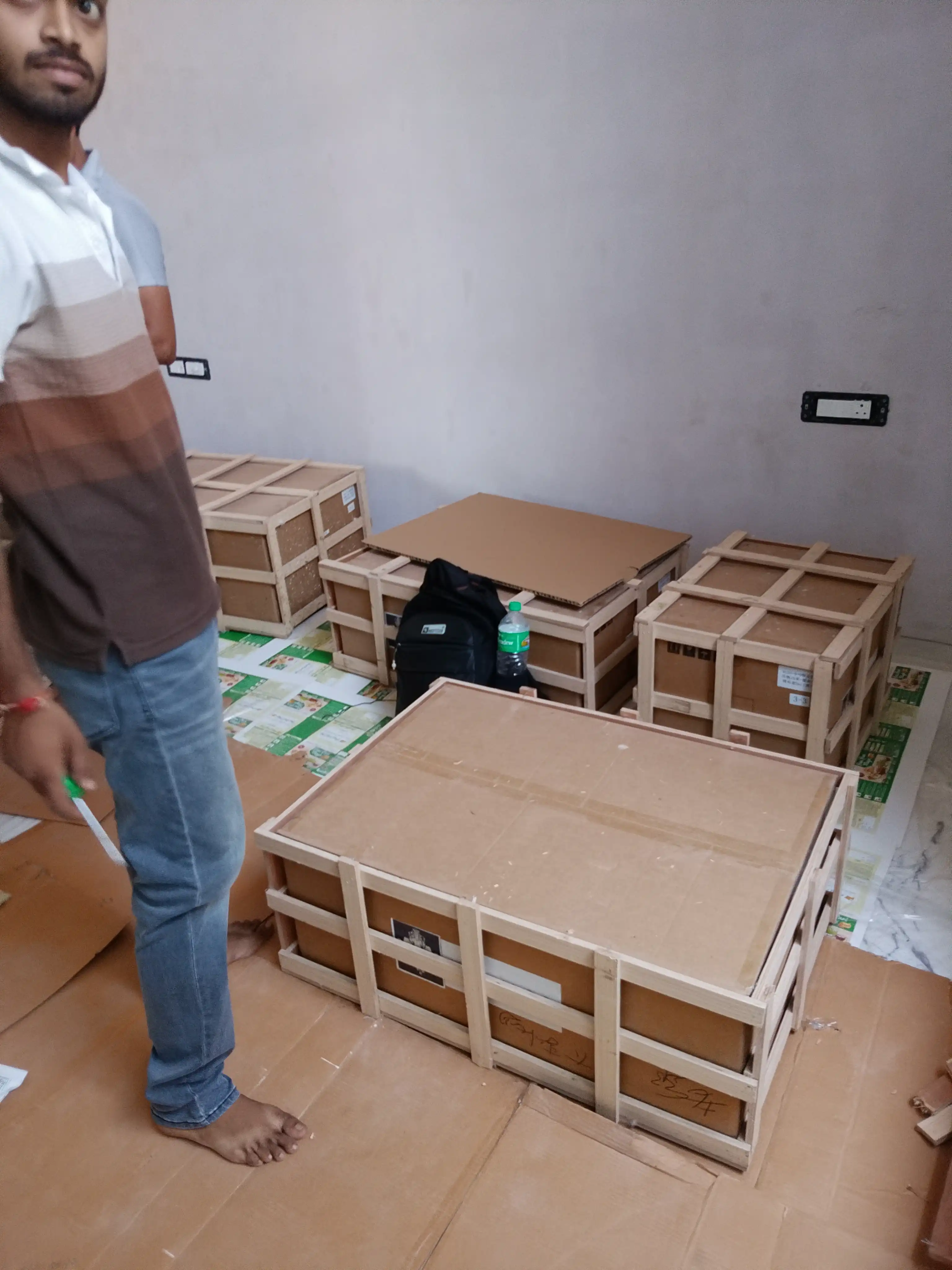 Imported chandelier components packed in wooden crates for safe transportation